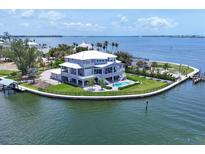 Stunning waterfront home with a private pool and dock, nestled on a peninsula with panoramic water views at 565 Green Dolphin S Dr, Placida, FL 33946