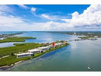Waterfront condos with amazing water views, lush landscaping, and a community pool and private boat docks at 1591 Beach Rd # 402, Englewood, FL 34223