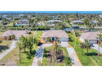 Lovely waterfront home with mature landscaping and paver driveway, perfect for enjoying the Florida lifestyle at 285 Spaniards Rd, Placida, FL 33946