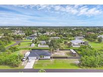 Expansive aerial view of a single-Gathering home with a large lot, including a boat and RV parking area at 10263 Waterford Ave, Englewood, FL 34224