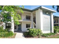 Inviting two-story condo with well-maintained landscaping and a welcoming entrance at 4655 46Th Street Ct # 101, Bradenton, FL 34210