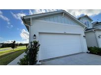 Two-car garage with white door at 9105 Gulf Haven Dr, Parrish, FL 34219