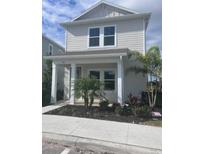 Two-story house with light gray siding, two-car garage, and small front yard at 164 Eagleston Ln, Lakewood Rch, FL 34240