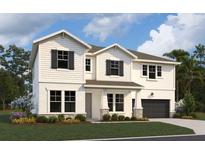 Charming two-story home with a manicured lawn and beautiful landscaping, plus a two car garage at 7454 Sea Manatee St, Parrish, FL 34219