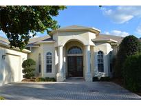 Charming single-Gathering home with a well-manicured front yard and a welcoming entranceway at 13550 Thoroughbred Dr, Dade City, FL 33525