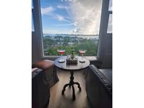 Cozy living area with beautiful water views and seating for relaxing at 33 S Gulfstream Ave # 803, Sarasota, FL 34236