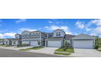 Charming new townhomes feature stylish exteriors, manicured landscaping, and attached garages at 9270 Gulf Haven Dr, Parrish, FL 34219