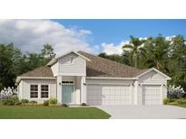 Charming single-Gathering home boasts a blue door, three-car garage and lush landscaping at 9608 Brave Buck Ave, Land O Lakes, FL 34638