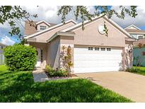 Charming one-story home with a well-maintained lawn, two-car garage and beautiful shrubbery at 4135 Rocky Fork Ter, Ellenton, FL 34222