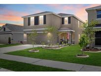 Charming two-story home featuring a landscaped yard and inviting entrance at 3270 Rock Sound St, Bradenton, FL 34208