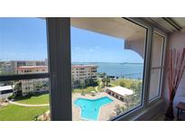 Inviting view of the pool and bay from the windows of this spacious condo at 632 Edgewater Dr # 832, Dunedin, FL 34698