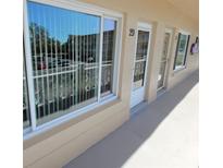 Exterior view of condo featuring large window with natural light and neutral paint at 2311 Brisbane St # 29, Clearwater, FL 33763
