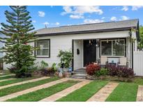 Charming home featuring a well-manicured lawn and inviting front porch at 4444 5Th S Ave, St Petersburg, FL 33711