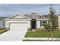 Single-Gathering home with stone accents at 16988 Oval Rum Dr, Wimauma, FL 33598