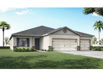 Charming single-Gathering home with well-maintained landscaping and a three car garage at 2432 White Ladyfish Rd, Wimauma, FL 33598