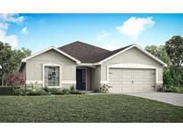 Charming single-story home featuring a well-manicured lawn and an attached two-car garage at 6022 Mangrove Creek Rd, Wimauma, FL 33598