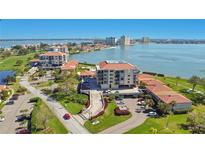 Scenic aerial view of the condo building complex near the water with lush greenery and meticulous landscaping at 6158 Palma Del Mar S Blvd # 604, St Petersburg, FL 33715