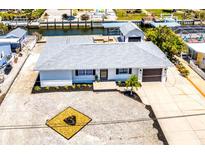 Charming waterfront home featuring a new roof, updated landscaping, and a private boat dock at 1046 Lee St, Englewood, FL 34224