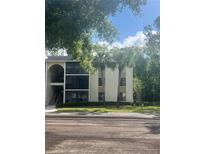 Inviting condominium featuring well-maintained landscaping and a private entrance at 3232 Lake Pine E Way # G1, Tarpon Springs, FL 34688