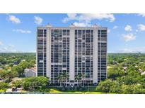 Striking high-rise condo building with meticulously maintained landscaping and gorgeous trees surrounding property at 3301 Bayshore Blvd # 503, Tampa, FL 33629