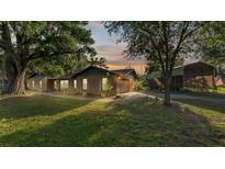 Charming single-story brick home featuring mature landscaping and a spacious lot at 4142 El Shaddiai Sq, Plant City, FL 33565