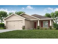 Charming single-story home with a well-manicured lawn, attached garage, and inviting front entrance at 2512 58Th E Cir, Palmetto, FL 34221