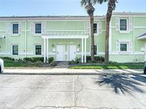 Charming two-story condo with white shutters and a welcoming pergola over the front doors at 4778 Coquina Key Se Dr # 4778, St Petersburg, FL 33705
