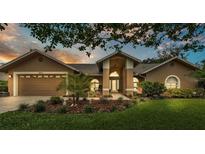 Charming single-Gathering home with a two-car garage, complemented by mature landscaping at 2912 Aston Ave, Plant City, FL 33566