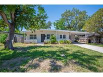 Charming single story home with a well manicured lawn and mature trees at 6011 67Th N Ave, Pinellas Park, FL 33781