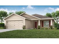 Charming single-story home with a two-car garage, well-manicured lawn, and inviting front entrance at 6957 161St E Ter, Parrish, FL 34219
