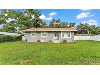 Charming single-story home featuring a well-maintained lawn and inviting front entrance at 1603 N Park Rd, Plant City, FL 33563