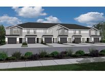 New construction townhomes with gray siding and black accents provide modern curb appeal at 2750 Walden Town Cir, Plant City, FL 33566