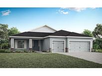 Charming single-Gathering home boasts a three-car garage, covered entrance, and well-manicured lawn at 2626 Scenic Park Loop, Wimauma, FL 33598