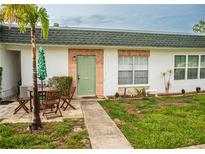 Charming single-story home features a quaint patio area and well-maintained landscaping at 7713 39Th N Ave, St Petersburg, FL 33709
