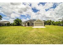 Charming single-story home with a well-manicured lawn and attached two-car garage at 3730 Ralston Rd, Plant City, FL 33566