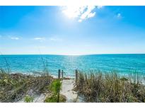 Beach access path leading to the ocean at 3999 Casey Key Rd, Nokomis, FL 34275
