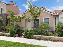 Cute house with a landscaped yard and a welcoming entrance at 930 E Venice Ave, Venice, FL 34285