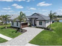 Luxury home with tile roof and paver driveway at 1729 Lugano Cir, Nokomis, FL 34275