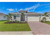 Newly built single-story home with light gray exterior at 1265 Cobble Glen Dr, Port Charlotte, FL 33953