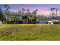 House exterior with a large yard at 4343 Carver St, North Port, FL 34286