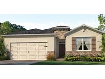 One-story home with two-car garage and stone accents at 16066 Highgate St, Port Charlotte, FL 33953