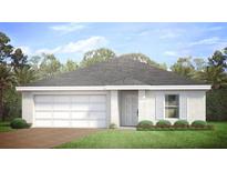 A charming one-story home with a two-car garage and a well-manicured lawn at 15081 Chamberlain Blvd, Port Charlotte, FL 33953