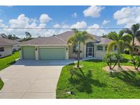 Single Gathering home exterior with two-car garage at 233 Fairway Rd, Rotonda West, FL 33947
