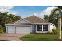 Two-car garage and gray exterior with landscaping at 1449 Olancha Ct, Punta Gorda, FL 33983