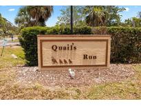 Community sign for Quail's Run with quail silhouettes at 8 Quails Run Blvd # 6, Englewood, FL 34223