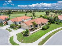 Aerial view of two homes in a golf course community at 122 Tiziano Way, North Venice, FL 34275