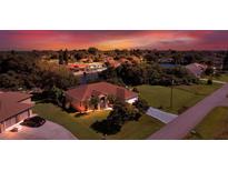 Attractive single-Gathering home on a canal with a beautiful sunset at 12004 Sarto Ln, North Port, FL 34287