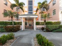 Building entrance with lush landscaping at 1403 Gondola Park Dr # 1403Bd, Venice, FL 34292