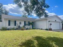 Charming single story home with well-manicured lawn at 6738 Brentford Rd, Sarasota, FL 34241