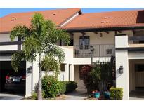 Two-story townhome with balcony and landscaping at 766 Avenida Estancia # 196, Venice, FL 34292